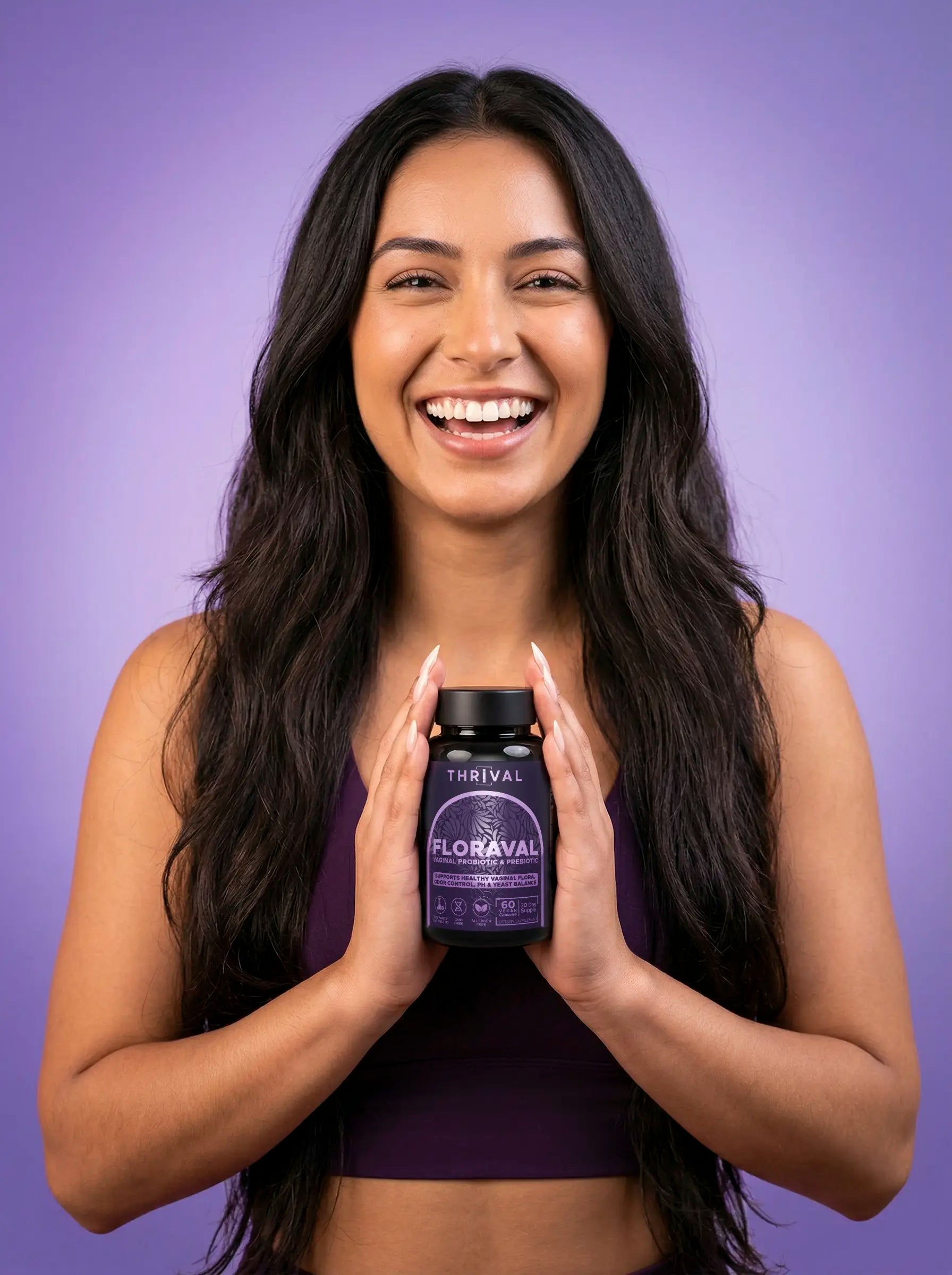 Woman holding probiotic bottle